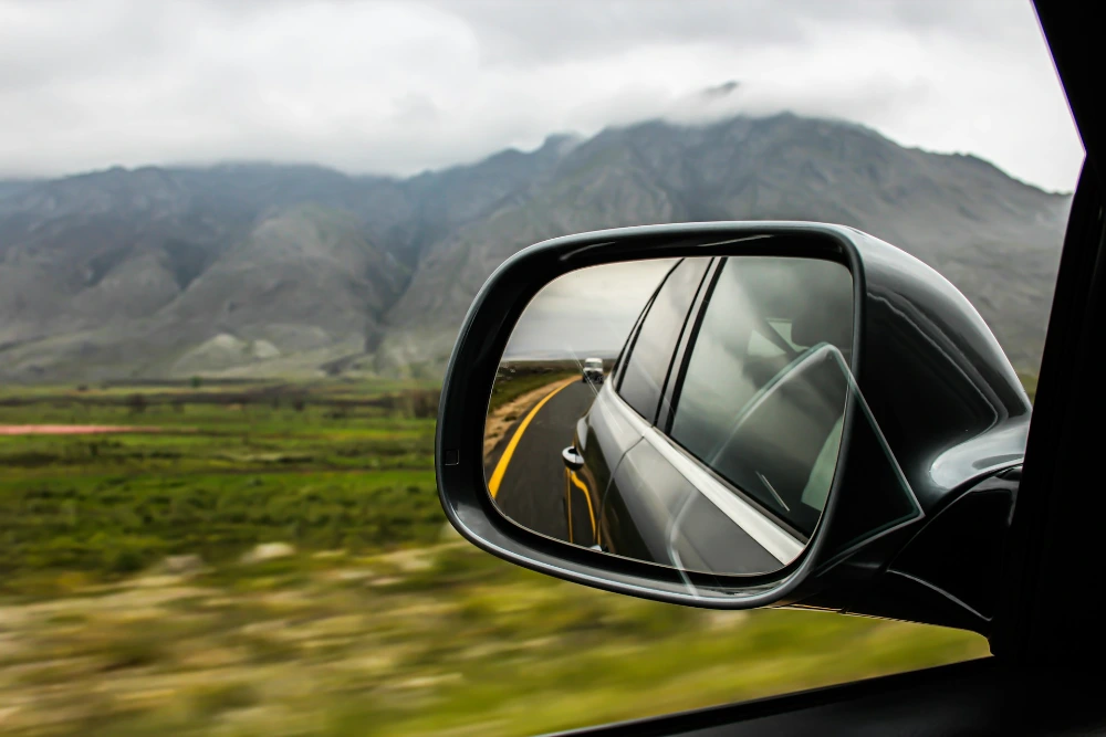 Rear view mirror with mountains in the background